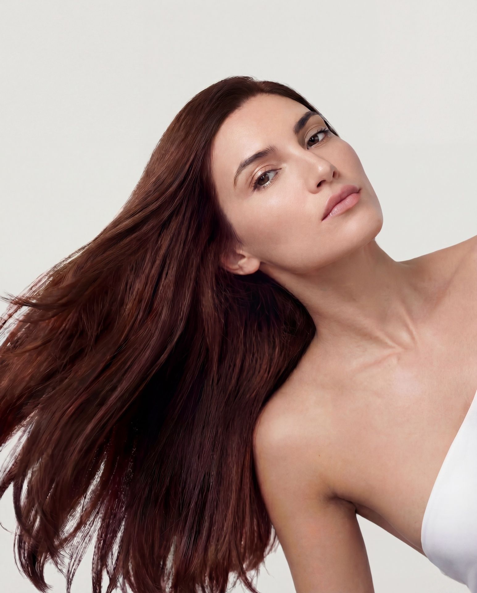 Woman with rich auburn hair flowing